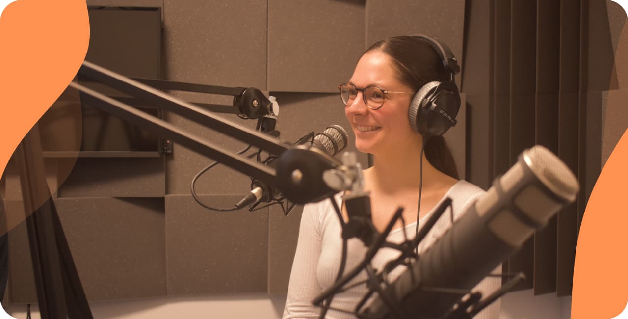 Woman in a radio studio with foam tiles and microphones