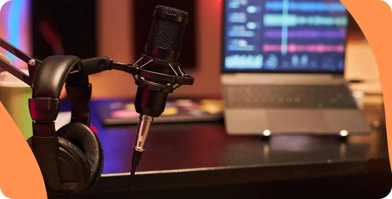 Microphone, headphones and radio automation tool in a studio.