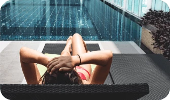 woman laying by the pool