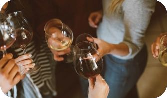 People listening to online radio and drinking wine in a bar